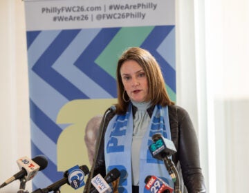 Meg Kane speaking at a podium