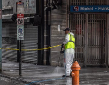 Workers cleaning the sidewalk