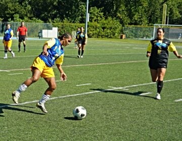 A member of the Brazil women's team kicks a soccer ball