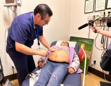 Dr. Armando Moreno performs an ultrasound on a patient at the CSVS Gonzales Clinic. (Mayra Pantoja)