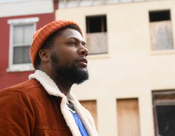 Shakoor Henderson checks out his old North Philadelphia neighborhood. (Bastiaan Slabbers for WHYY)