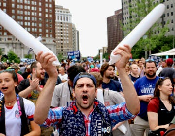 Soccer fans celebrate in Love Park