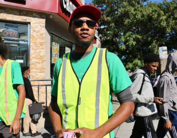 Paul T. Jackson, 34, works with Frontline Dads patrolling the area around Broad and Susquehanna at dismissal time to look out for potential violence. His own experience with stop and frisk makes him think it is not a good idea. (Emma Lee/WHYY)