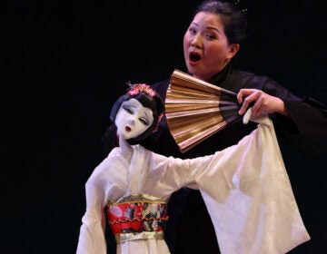 The title role of Madame Butterfly in Opera Philadelphia's production is represented by a puppet, voiced and manipulated by Karen Chia-ling Ho.