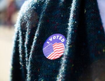 A Pennsylvania voter in Camp Hill wears an I Voted sticker on Election Day, Nov. 8, 2022.