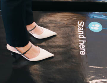 A passenger stands on scales at Auckland International Airport as part of a survey to generate average weights for people traveling on Air New Zealand flights.
(Courtesy of Air New Zealand)