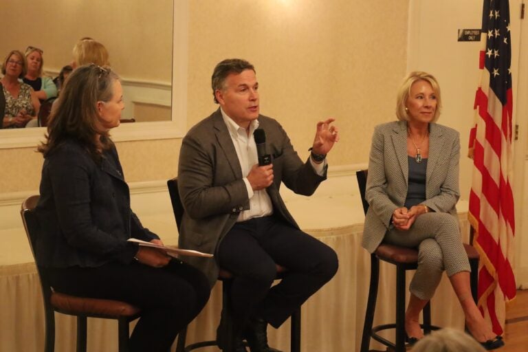 Republican Senate candidate David McCormick discusses education and “woke ideology” with  Aly Warner (left), chair of the Northampton County chapter of Moms for Liberty, and Betsy DeVos (right), secretary of education under the Trump Administration. (Carmen Russell-Sluchansky)