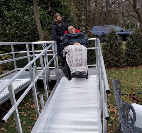 Man being pushed on a wheelchair