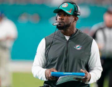 File photo: Miami Dolphins head coach Brian Flores stands on the sideline during the second half of an NFL football game against the New England Patriots, Sunday, Jan. 9, 2022, in Miami Gardens, Fla. (AP Photo/Wilfredo Lee)