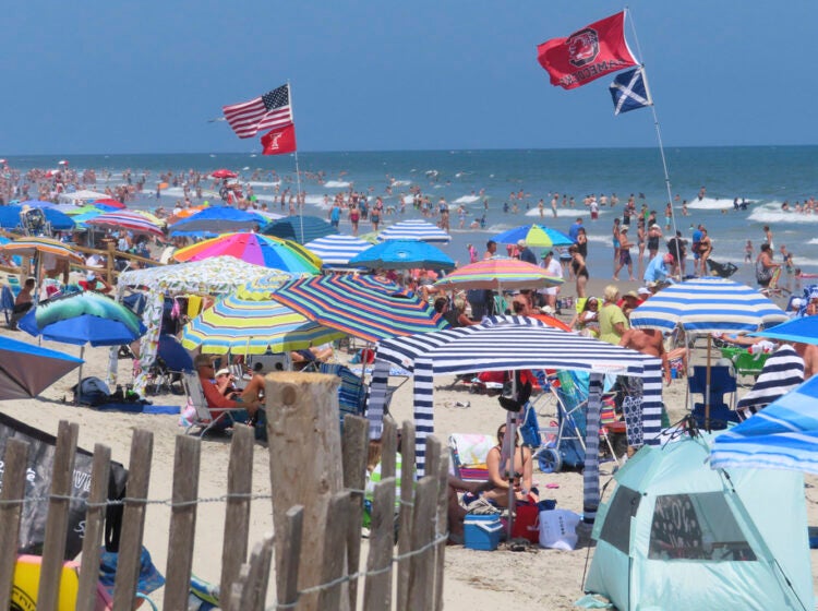 Beachgoers enjoy the sand and surf in North Wildwood N.J. on July 7, 2023. (AP Photo/Wayne Parry)