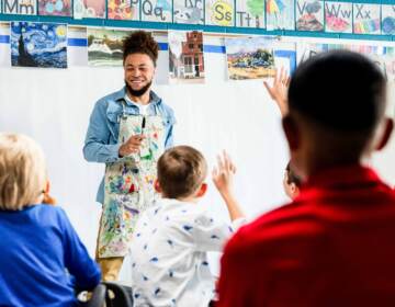 Art teacher in front on students