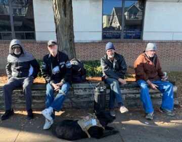 Chuck Jones and his dog, Midnight (center left) enjoying an outing with Breaking Bread shelter residents.