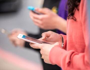 A woman looking at her cell phone