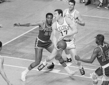 Boston Celtics' John Havlicek is defended by Philadelphia 76ers' Chet Walker