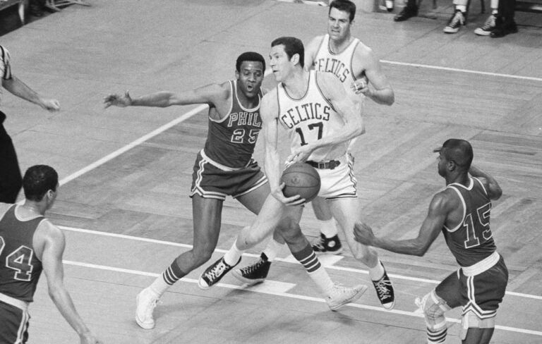 Boston Celtics' John Havlicek is defended by Philadelphia 76ers' Chet Walker