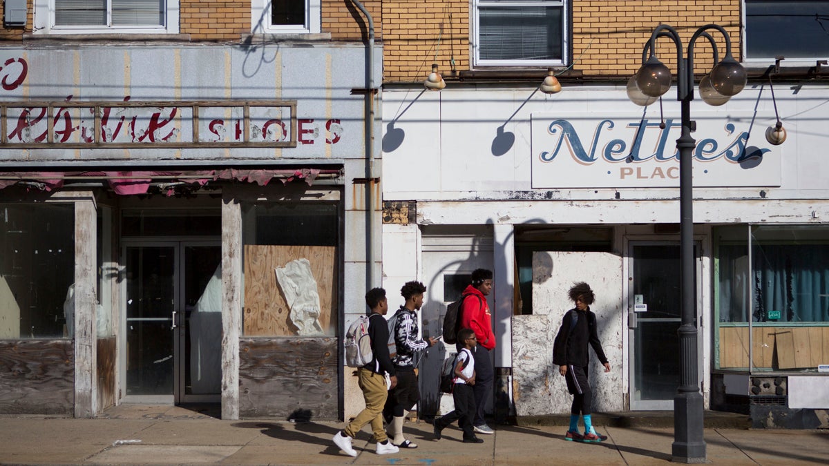  Kids walk down Miller Avenue passed shuttered businesses in downtown Clairton, Pennsylvania. (Jessica Kourkounis/For Keystone Crossroads) 