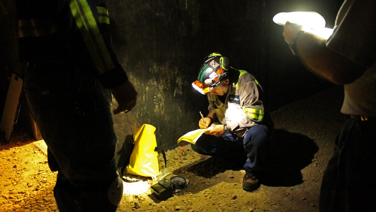  Racing the clock, a member of one of Bailey Mine's rescue teams calculated air flow after taking a gas measurement during the first aid support skills event. (Margaret J. Krauss/WESA) 