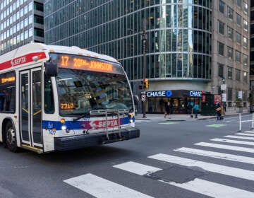 SEPTA bus passes through the intersection of N 17th and JFK Boulevard.