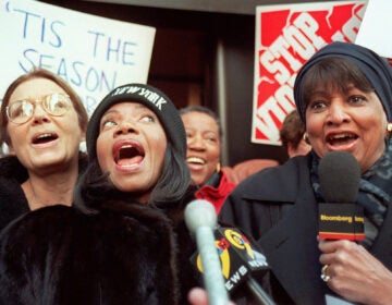 C. DeLores Tucker (right) joins Gloria Steinem (far left) and Melba Moore (center) to sing during a protest against lyrics they say promote violence against women outside Time Warner offices in New York on Dec. 18, 1997. (AP Photo/Michael Schmelling)