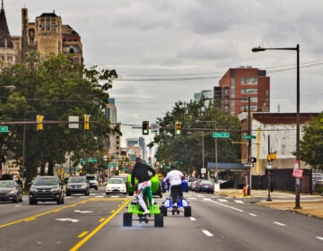 Young people riding ATVs through the streets of Philly. (Kimberly Paynter/WHYY)