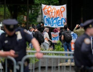 People react to the guilty verdict announced against former President Donald Trump outside Manhattan Criminal Court, Thursday, May 30, 2024, in New York.