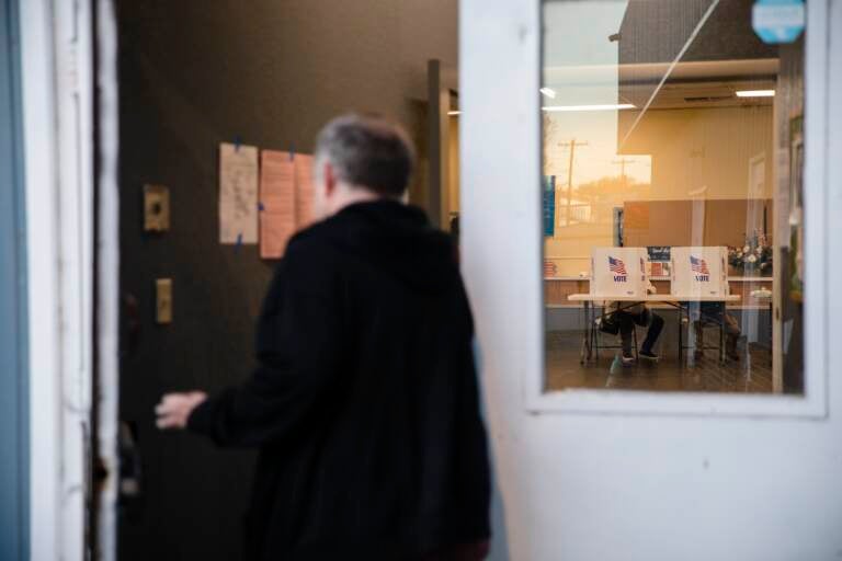 Man enters polling place.