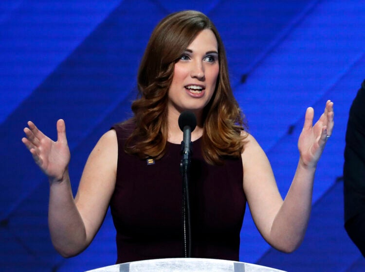 Sarah McBride speaking at a podium