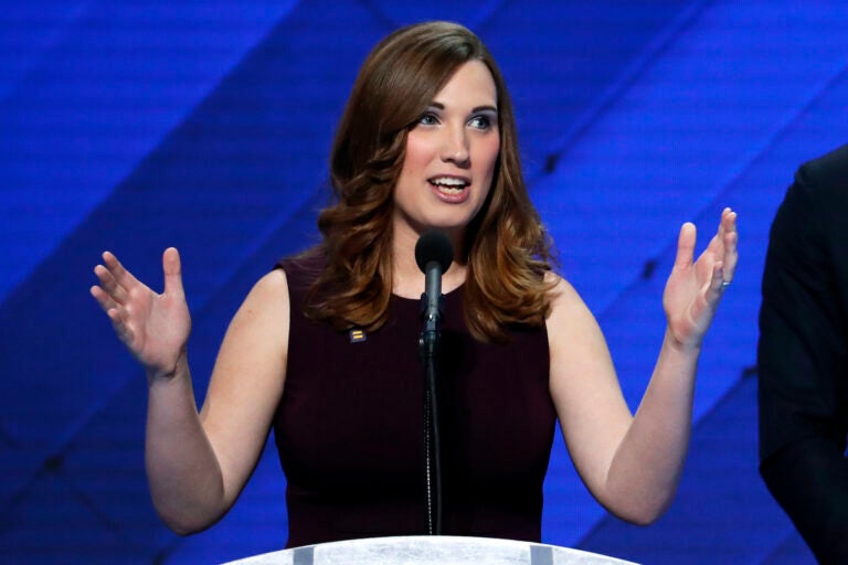 Sarah McBride speaking at a podium