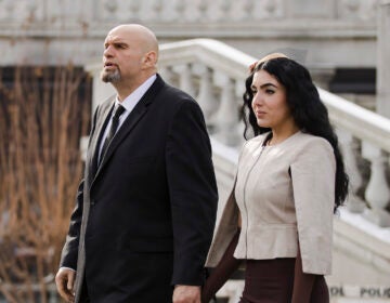 Pennsylvania Lt/ Gov. John Fetterman and his wife Gisele Barreto Fetterman walk to Gov. Tom Wolf's inauguration