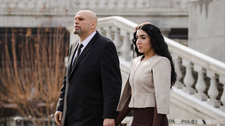 Pennsylvania Lt/ Gov. John Fetterman and his wife Gisele Barreto Fetterman walk to Gov. Tom Wolf's inauguration