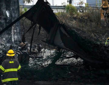 A firefighter views the aftermath