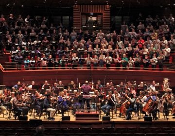 FILE - The Philadelphia Orchestra teams up with 250 singers from four choirs during a rehearsal for 'Philadelphia Voices' at the Kimmel Center. (Emma Lee/WHYY)