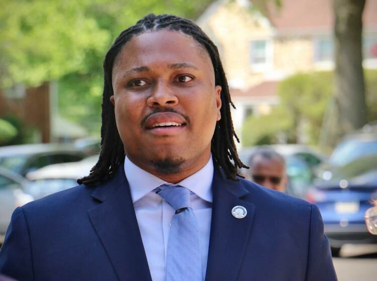 Pa. State Rep. Malcolm Kenyatta (left), running for the Democratic nomination for U.S. Senate, greets voters as they arrive at the polling place at Elkins Park School.