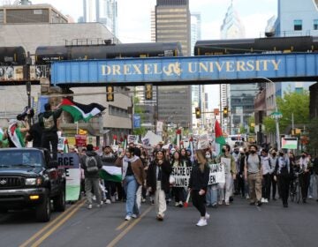 Protesters march from City Hall down Market Street near Drexel