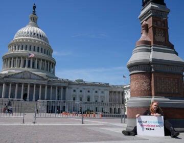 Jennifer Gay, a TikTok content creator, sits outside the U.S. Capitol