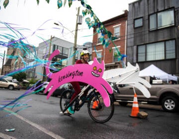 The Kensington Kitty soars through Philadelphia Brewing Company’s ‘Peacock Passage’ obstacle during the race at the Kensington Derby and Arts Festival on Saturday.