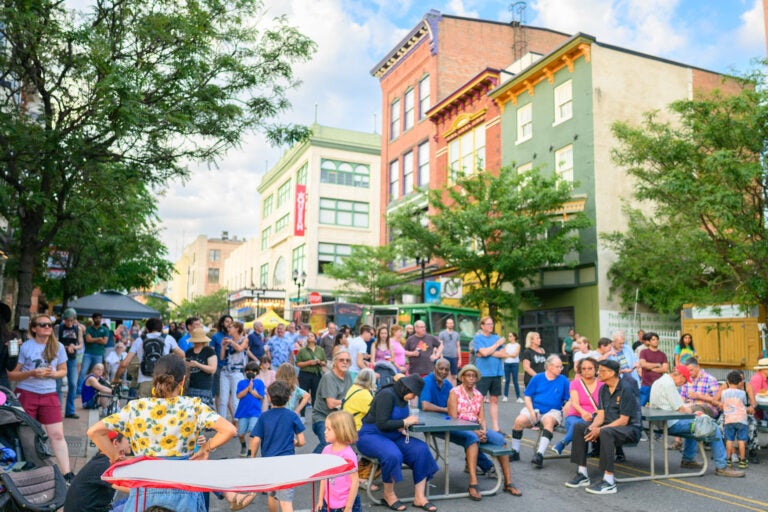 Those enjoying the LadyBug Music Festival sat at one of the festival's designated rest spots, where food vendors await, during the 2023 event. (Courtesy of Moonloop Photography)