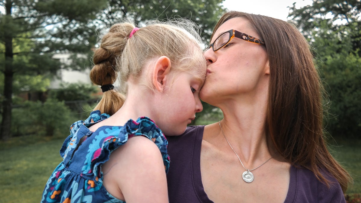 Liz Buvinger holding her daughter