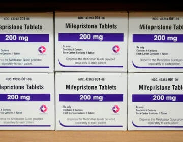 Boxes of pills sitting on a table.