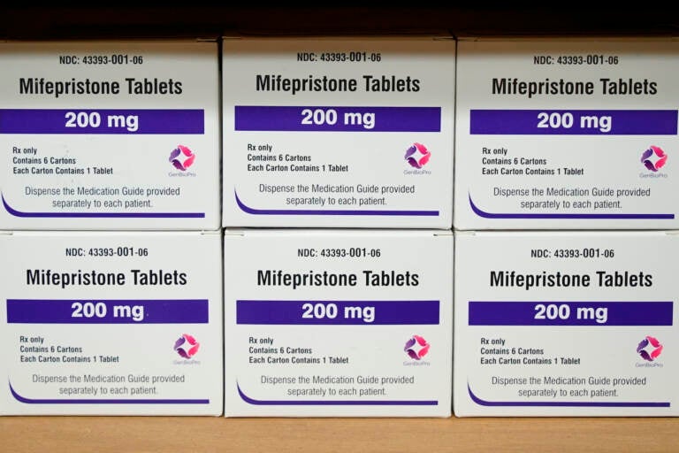 Boxes of pills sitting on a table.