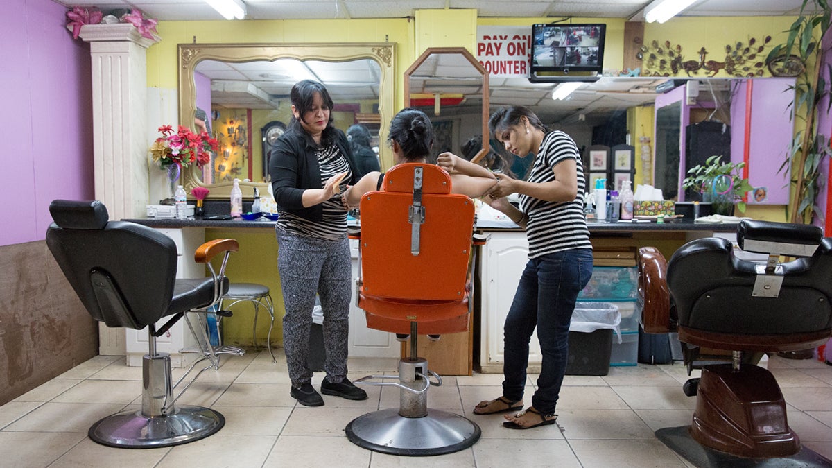  Seema Chauhan (left) and Pushpa Kumari (right) wax a customer at Sonia’s Beauty Palace and Boutique in Millbourne, Pa. (Lindsay Lazarski/WHYY) 