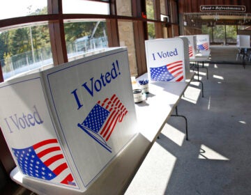 A polling places with boxes that say 