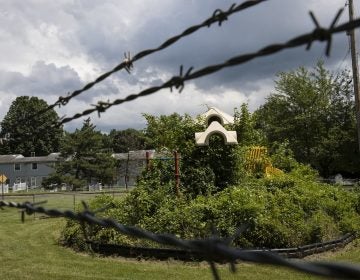 In this Aug. 1, 2018 photo weeds engulf a playground at housing section of the former Naval Air Warfare Center Warminster in Warminster, Pa. the foams once used routinely in firefighting training at military bases contained PFAS. (Matt Rourke/AP Photo)