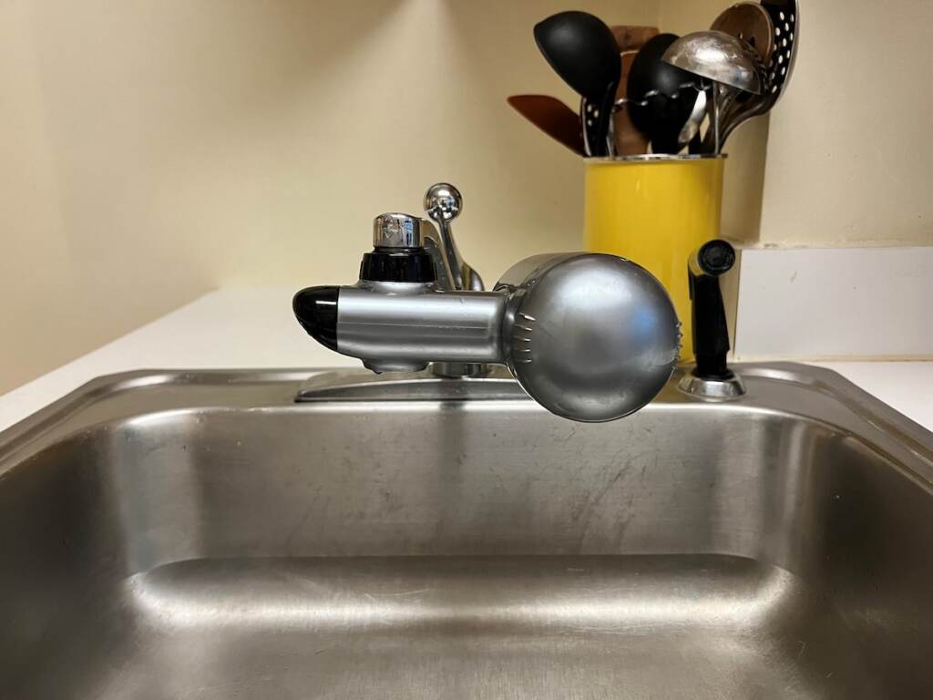 A filter on a faucet is shown.