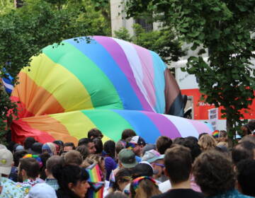 Massive pride flag getting unfurled at Philly Pride.