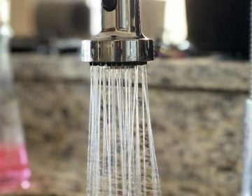 running water in a kitchen sink.