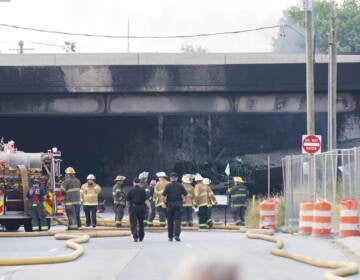 First responders work to extinguish a vehicle fire, Sunday June 11, 2023, that caused an overpass on I-95 to collapse near the Cottman Avenue exit