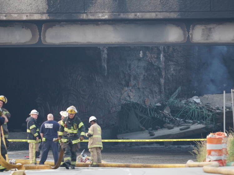 First responders work to extinguish a vehicle fire, Sunday June 11, 2023, that caused an overpass on I-95 to collapse near the Cottman Avenue exit