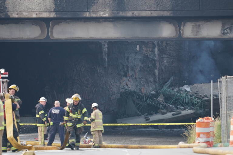 First responders work to extinguish a vehicle fire, Sunday June 11, 2023, that caused an overpass on I-95 to collapse near the Cottman Avenue exit