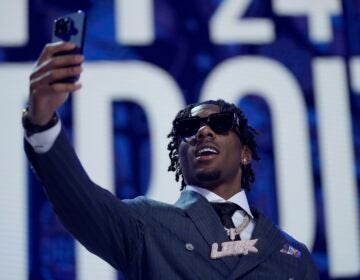 Toledo cornerback Quinyon Mitchell walks on stage during the first round of the NFL football draft, Thursday, April 25, 2024, in Detroit.